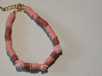 SÄNKT PRIS ! Egenhändigt gjort armband. I färgerna dov rosa och tegel färgad.