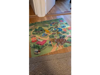 Dinosaurie lekset med lekmatta och förvaringspåse