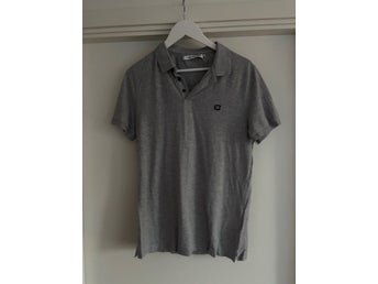 Calvin Klein Jeans grå pikétröja, storlek M