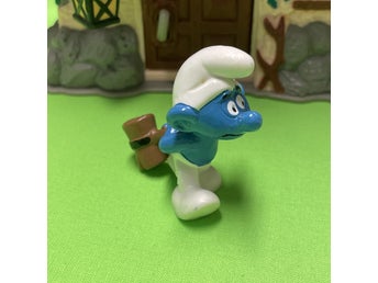 Smurf med stor slägga bakom ryggen….toppskick… lågt utrop…