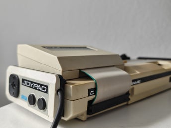 Sega Mark III spillekonsol med FM Sound Unit