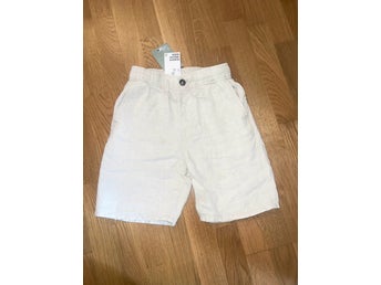 Nya med prislapp - H&M beiga shorts i linne storlek 134.