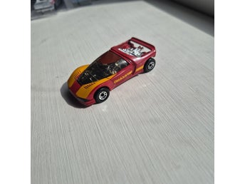 Matchbox Peugeot Quasar, röd och gul leksaksbil