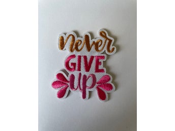 NEVER GIVE UP TYGMÄRKE