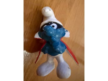 Smurf-figur i superhjältedräkt