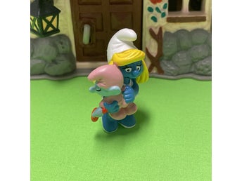 Smurfan med smurf bebis på armen….toppskick… lågt utrop…