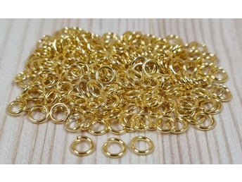 100 st jumprings / bindringar (4 mm, guldfärgade)