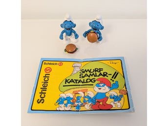 Två Schleich Hamburger-Smurf (från 1983) och samlarkatalog för Smurfar