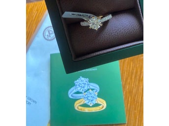 Exklusiv oanvänd guld- och diamantring – ny plomberad med kvitto