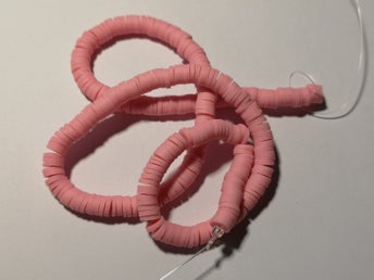 ca 40 cm fina tegel färgade Polymera Heishi pärlor.