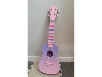 Leksaksukulele i rosa och