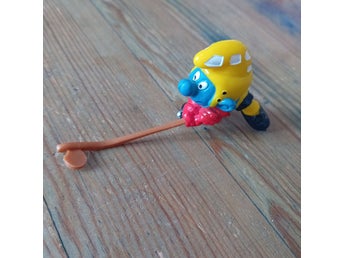 Väldigt fin vintage hockeyspelande smurf ishockey klubba puck.