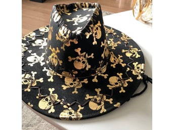 Svart, guld hatt