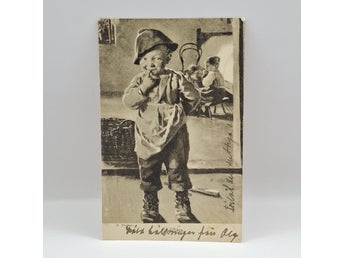 M. Wünsch – En fiffig kus – pojke med korv – konstnärsvykort tidigt 1900-tal