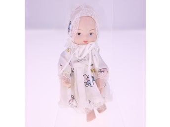 Vintage porcelain baby doll with handmade outfit